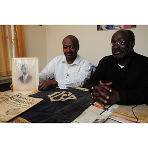 Stephen Hunter and David F. Hunter pose with a photograph of their father, Laymon Hunter