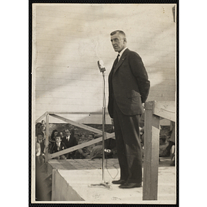 Elwood S. McKenney standing at a microphone