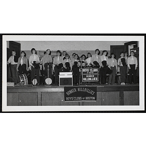 The Bunker Hillbillies pose with their instruments on a stage