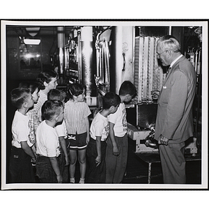 Children tour a Hood dairy plant during a day camp outing