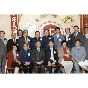 Members of the Chinese Progressive Association pose for a photograph with members of the Guangdong province delegation at a gathering held during the delegation's visit to Boston