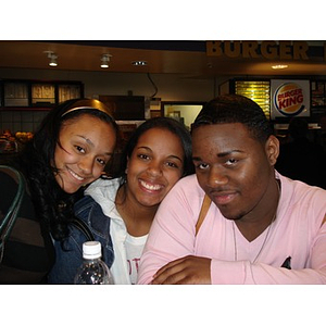 Three Torch Scholars in front of a Burger King on a visit to Washington D.C