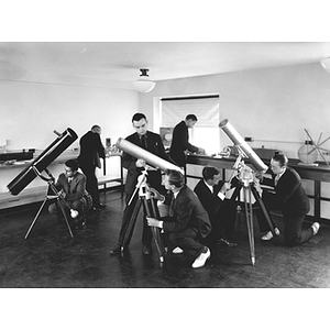 Students looking at telescopes in Northeastern's Astronomy Club