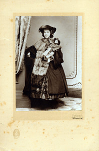 Reproduction of full-length studio portrait of Grace Aspinwall Bowen, standing, facing front, holding her doll, Lena Rivers, Bachrach, New York, New York