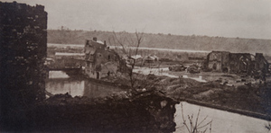 View from above of a destroyed church along a river bank