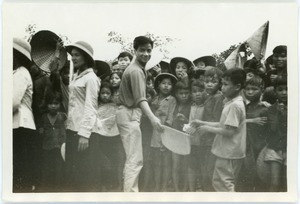 Guide Nguyen and curious village schoolchildren