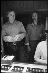 Stephen Stills (left) and David Crosby with sound engineer Bill Halverson (obscured) in Wally Heider Studio 3 during production of the first Crosby, Stills, and Nash album