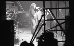 Grateful Dead concert at Springfield Civic Center: shot from behind the stage of Jerry Garcia (guitar)