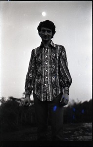 Mike Scanlon (commune member), standing in a field