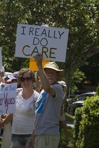 Protesters holding up a sign reading 'I really do care': taken at the 'Families Belong Together' protest against the Trump administration’s immigration policies