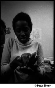 Girl with the class hamster: Liberation School, Boston, Mass.