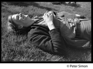 Livingston Taylor, lying on the lawn, smoking a cigarette