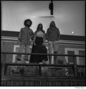 Ram Dass and Satsang: Ram Dass (right), Mirabai Bush, and Daniel Goleman on a beach house deck with Cosmos the dog