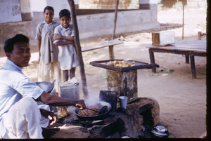 Cooking at a market in Mangadu