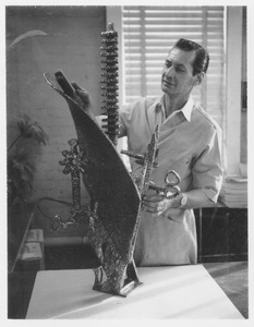 Lyle Perkins with a sculpture