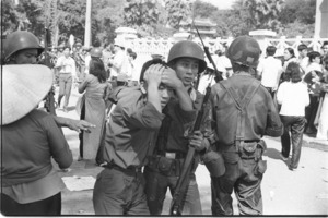 Soldiers arresting political demonstrators who will be drafted into the army; Saigon.