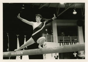 Springfield College gymnast performing balance beam routine