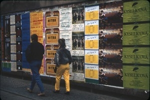 Advertisements posted on a street wall