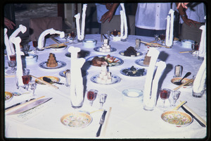 Dinner for Zhou Peiyuan: place settings at dinner table