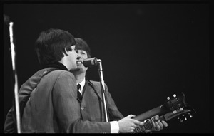 Paul McCartney and John Lennon performing with the Beatles at the Washington Coliseum