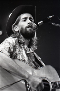 New Riders of the Purple Sage opening for the Grateful Dead at Sargent Gym, Boston University: John 'Marmaduke' Dawson playing acoustic guitar and singing