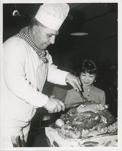 Chef Joseph Zema carving turkey at Thanksgiving celebration