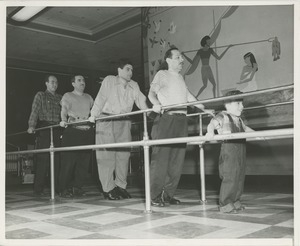 David Grierson and men using parralel bars