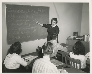 ICD instructor teaching grammar to an academic class of four students