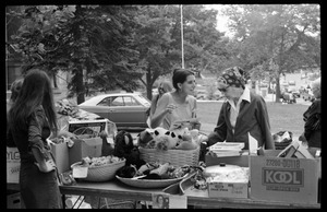 Women looking over goods at the Unitarian Society tag sale, Northampton