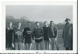 Roger Maloney standing with cross country teammates (December, 1958)