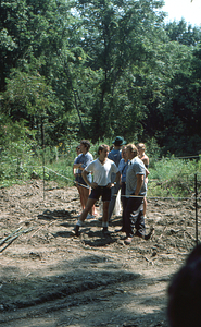 Peter McChesney (white shirt) converses with Richard Babcock (blue print shirt) Moon Barn Raising at entrance to Hopkins Forest on 2 August 1975.