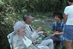 Ella and Arthur Rosenburg (seated left to right) talking with Steven Masters at Moon Barn Raising at entrance to Hopkins Forest on 2 August 1975.
