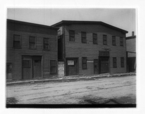 View of street in front of a building with a "to let" sign, probably Dorchester Ave.