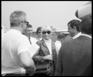Unidentified woman at airport as Beatles arrive