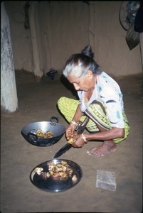 >Ama, mother of guide K.P. Kafle, preparing food