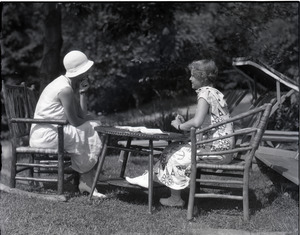 Dorothy Canfield Fisher: Fisher and unidentified woman, seated at a table outdoors