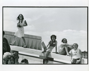 Photographer on wall at New York State Women's meeting