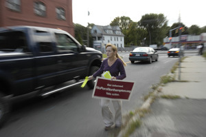 Protest against a pornographic video store in Northampton: protester handing out fliers to cars on North Street