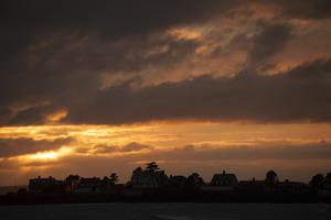 Houses on a point of land at sunset