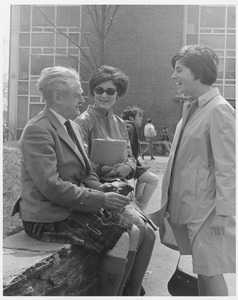 Hugh MacDiarmid, sitting and talking with two female students