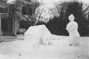 Winter Carnival snow sculpture of a man in the doghouse