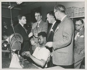 Attendees observe an ICD client at work at the 1959 Rehabilitation Counselors Conference