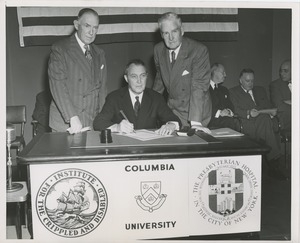 Joseph Campbell, treasurer at Columbia University, signing affiliation agreement