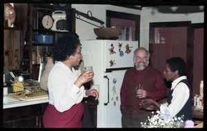Esther Terry, Bob Abel, and unidentified woman in the kitchen, at the book party for Robert H. Abel