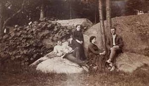 George C. Adams, Charles F. Adams, Mary O. Adams, and Mary Adams, at Beverly Farms, seated on rocks