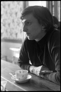 Solange 'Nellie' Hertz seated at a table at home with a cup of coffee