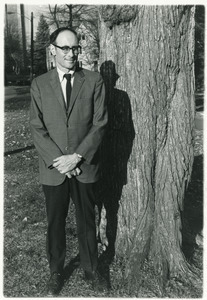 Sidney Lipshires standing in front of a tree on the Manchester Community College campus