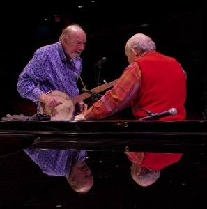 Pete Seeger talking with George Wein (on piano) at the Power of Song Award concert, Symphony Space, New York City