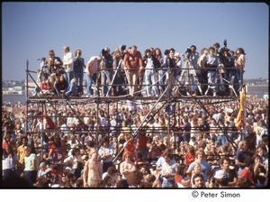 MUSE concert and rally: photographers on scaffolding amidst crowd of demonstrators