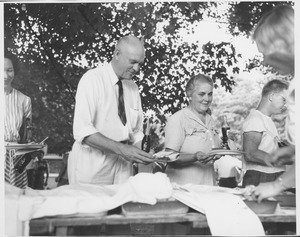 Ralph A. Van Meter with wife at outdoors summer barbecue